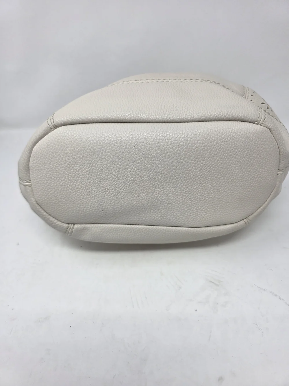 ​The Sak Off White Pebbled Leather Hobo Bag Perforated Cutout Tassel